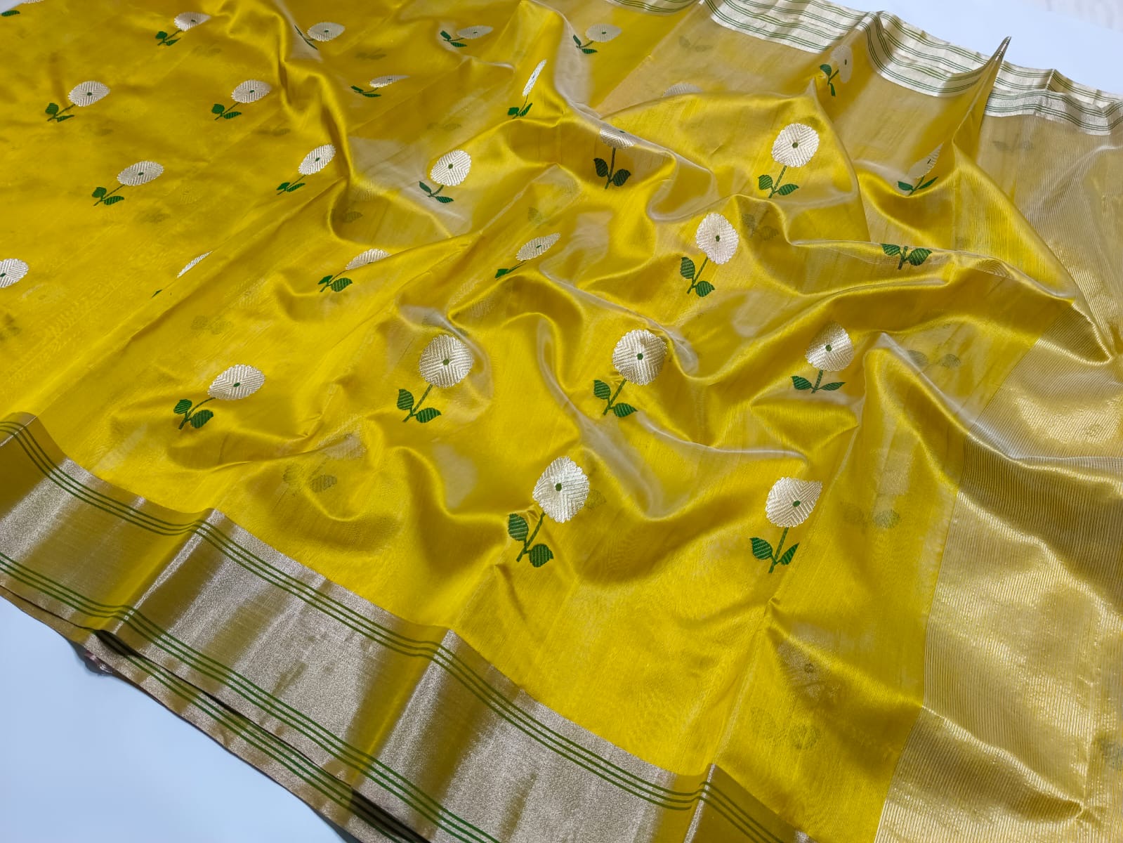 Beautiful Chanderi Pattu Silk Saree with silver zari and meenakari thread weave .